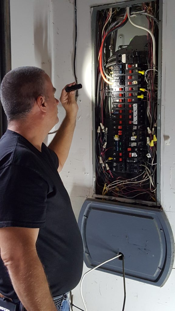 Inspecting electrical panel photo